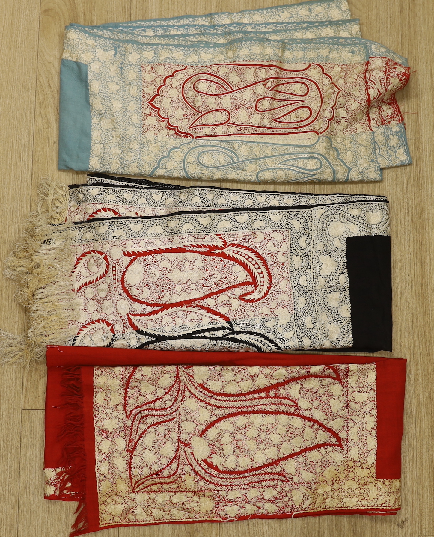 Three 19th century Indian cream silk floss embroidered wool stoles